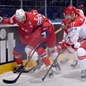 MINSK, BELARUS - MAY 11: Norway's Jonas Holos #6 battles for the puck with Denmark's Jannik Hansen #36 and Nicklas Jensen #17 during preliminary round action at the 2014 IIHF Ice Hockey World Championship. (Photo by Richard Wolowicz/HHOF-IIHF Images)